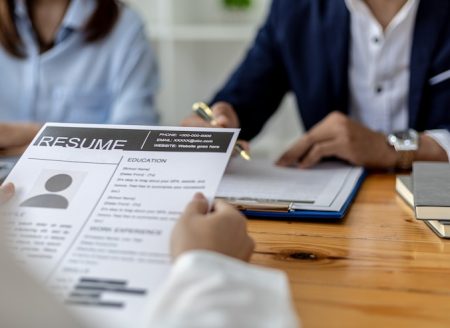 atmosphere-interview-room-start-up-company-applicant-is-handing-resume-interviewer-as-supporting-document-interview-two-interviewers-job-interview-concept_528263-722